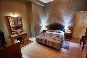 Postel nebo postele na pokoji v ubytování Exis Hotel