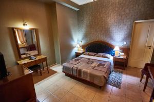 Postel nebo postele na pokoji v ubytování Exis Hotel