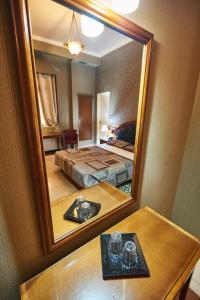 Postel nebo postele na pokoji v ubytování Exis Hotel