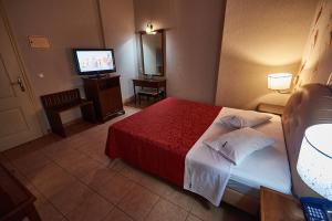 Postel nebo postele na pokoji v ubytování Exis Hotel