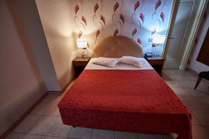 Postel nebo postele na pokoji v ubytování Exis Hotel