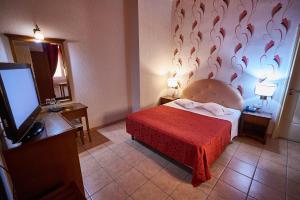 Postel nebo postele na pokoji v ubytování Exis Hotel