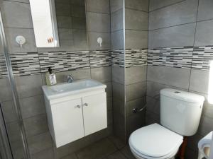 a bathroom with a toilet and a sink at Chez Khadija Et Franz in Essaouira