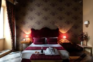 Posteľ alebo postele v izbe v ubytovaní Navona Grand Suite