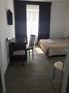 Postel nebo postele na pokoji v ubytování Neopolis