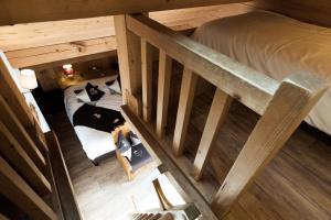 Postel nebo postele na pokoji v ubytování Les Chalets de La Griyotire