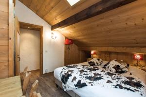 Postel nebo postele na pokoji v ubytování Les Chalets de La Griyotire