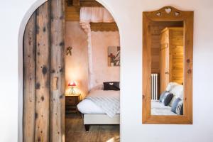 Postel nebo postele na pokoji v ubytování Les Chalets de La Griyotire