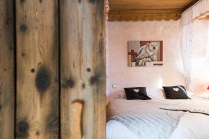 Postel nebo postele na pokoji v ubytování Les Chalets de La Griyotire