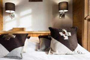 Postel nebo postele na pokoji v ubytování Les Chalets de La Griyotire