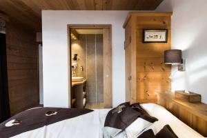 Postel nebo postele na pokoji v ubytování Les Chalets de La Griyotire