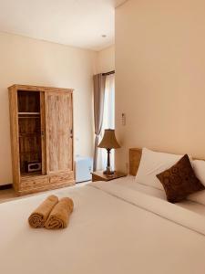 Postel nebo postele na pokoji v ubytování Gajahmina Guesthouse