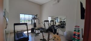a room with a bunch of exercise bikes in it at Guines Palace Hotel in Patrocínio