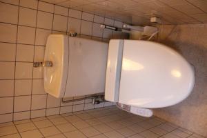 a bathroom with a urinal in a bathroom stall at Guesthouse Higashiyama Jao in Kyoto +47 photos
