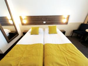 מיטה או מיטות בחדר ב-Zenith - Top Country Line - Conference & Spa Hotel