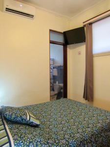 Postel nebo postele na pokoji v ubytování Hotel La Guaria Inn & Suites