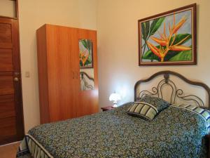Postel nebo postele na pokoji v ubytování Hotel La Guaria Inn & Suites