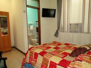 Postel nebo postele na pokoji v ubytování Hotel La Guaria Inn & Suites