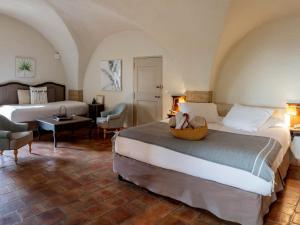 A bed or beds in a room at Garrigae Abbaye de Sainte Croix