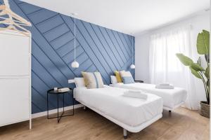 Łóżko lub łóżka w pokoju w obiekcie Style Apartments by Olala Homes