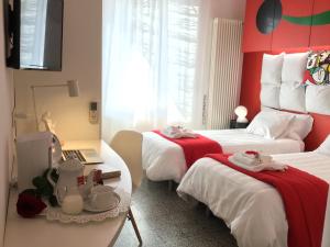 Postel nebo postele na pokoji v ubytování Il Piccolo Rooms