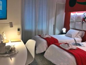 Postel nebo postele na pokoji v ubytování Il Piccolo Rooms