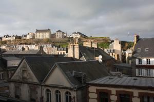 a view of a city with buildings and houses at L'ALBATROS in Granville