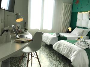 Postel nebo postele na pokoji v ubytování Il Piccolo Rooms