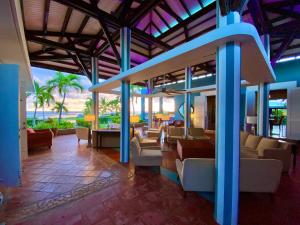 a lobby of a resort with couches and chairs at Blue Horizon Boutique Resort in Vieques