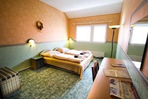 Posteľ alebo postele v izbe v ubytovaní Piknik Wellness Hotel