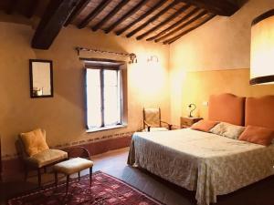 Postel nebo postele na pokoji v ubytování La Locanda del Loggiato