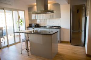 a kitchen with a large island in the middle at LE TERRAZZE 1 in Puerto de la Cruz