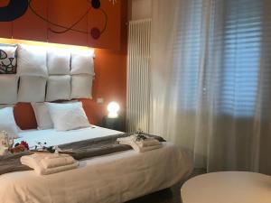 Postel nebo postele na pokoji v ubytování Il Piccolo Rooms