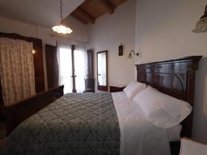 Postel nebo postele na pokoji v ubytování Agriturismo Torre Mannella - La Loggia