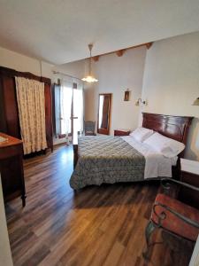 Postel nebo postele na pokoji v ubytování Agriturismo Torre Mannella - La Loggia