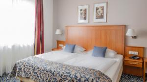Postel nebo postele na pokoji v ubytování Hotel Göller