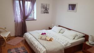 Postel nebo postele na pokoji v ubytování Apartman Ivan