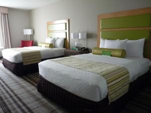 two beds in a hotel room with two at La Quinta by Wyndham Paducah in Paducah