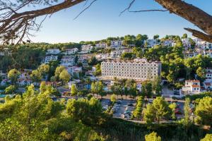 a view of the city from the hill at Minura Cala Galdana & Apartamentos d'Aljandar in Cala Galdana