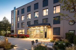 アッシュハイムにあるGolden Ball, Exclusive Serviced Apartments Munichの建物の正面のレンダリング