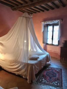 Postel nebo postele na pokoji v ubytování La Locanda del Loggiato