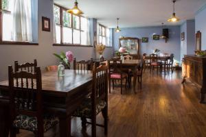 a dining room with a table and chairs at Hotel El Carmen in Ribadesella