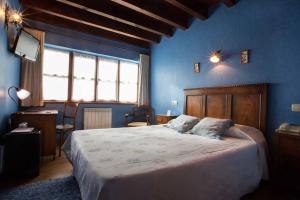 Postel nebo postele na pokoji v ubytování Hotel El Carmen