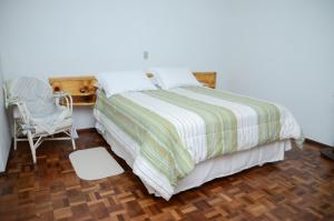 Кровать или кровати в номере Pousada Adler