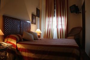 Een bed of bedden in een kamer bij Residencial Panorama