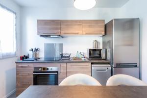 Η κουζίνα ή μικρή κουζίνα στο Magnifique Appartement proche gare - 8min Disney
