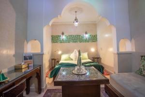 Postel nebo postele na pokoji v ubytování Riad El Walida