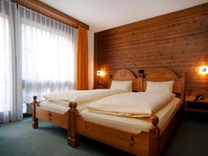 Cama ou camas em um quarto em Ambiente Guesthouse