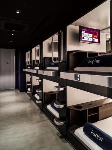 a room with a row of bunk beds at Kepler Club Sabiha Gökçen Airport - International Transit Area in Istanbul