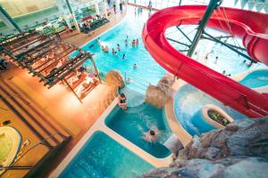an overhead view of a pool at a water park at Ventspils Seaside Lux Apartments in Ventspils